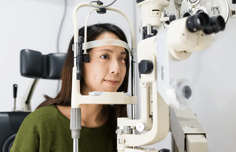 a woman getting a comprehensive eye exam