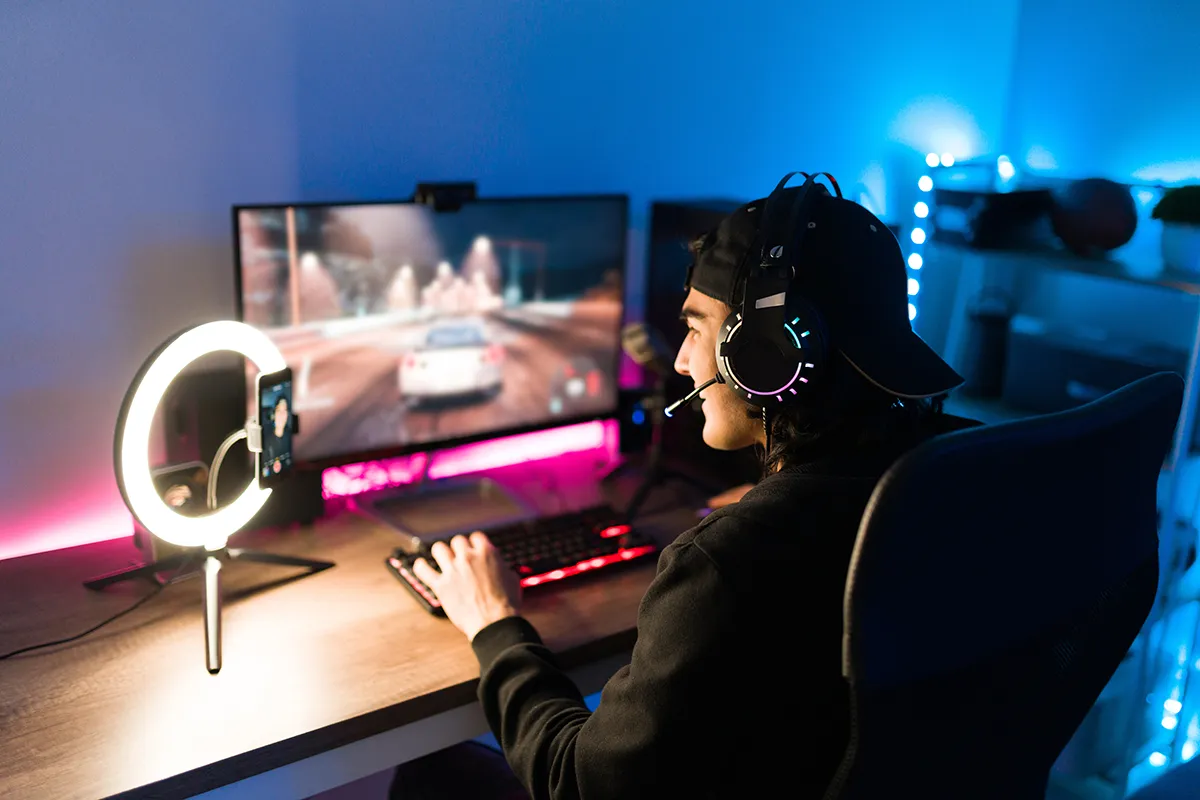 a young gamer playing a racing game while livestreaming